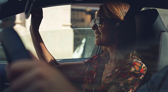 Smiling woman inside car